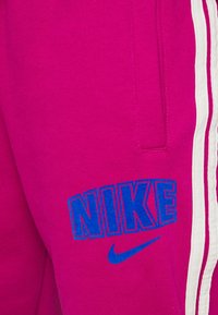 Nike Sportswear Träningsbyxor - mauve