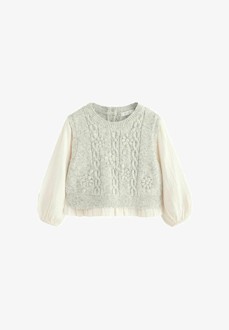 Strikket sweater med en lys grå tekstureret overdel og broderede blomster mønstre, med cremede pufærmer og en cropped bund.