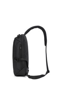 Zaino nero realizzato in materiale resistente, caratterizzato da un design elegante, tasche con zip, cinghia regolabile e manico texturizzato per una migliore presa.