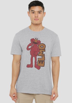 Gray t-shirt featuring a red Elmo character graphic with the text "ELMO" in brown. Cotton material, crew neckline, short sleeves.