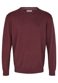 Maroon sweater made of soft knit fabric, featuring a round neckline, long sleeves, ribbed cuffs, and a subtle navy logo on the chest.