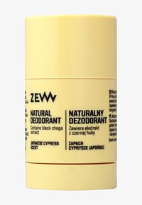 Naturalny dezodorant w sztyfcie Zew z ekstraktem czarnego chagi, o zapachu japońskiego cyprysu, beżowy cylindryczny pojemnik z dwujęzycznym tekstem w języku angielskim i polskim.