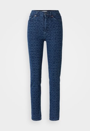 Pantalons en denim bleu foncé avec un motif géométrique. Design classique à cinq poches avec des rivets en cuivre et une fermeture à bouton.