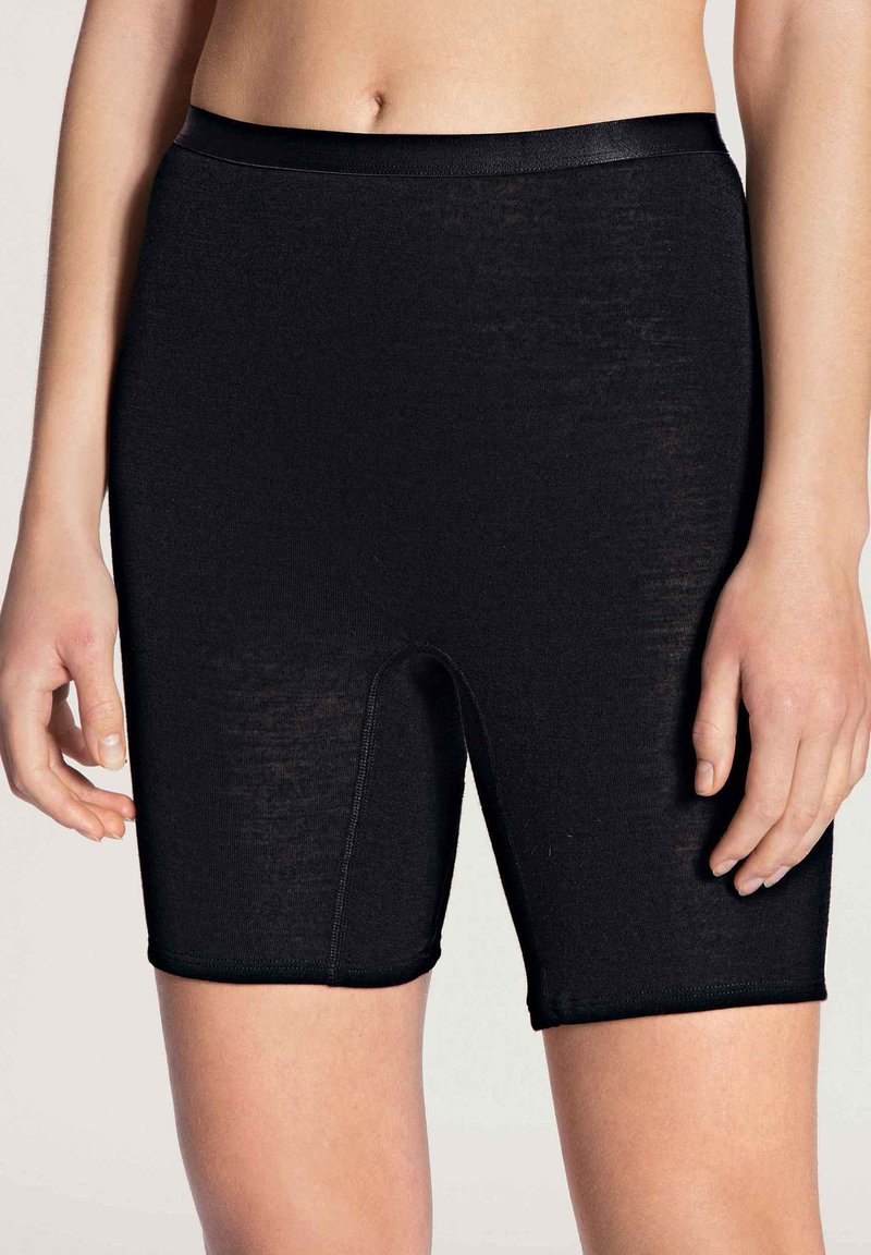 Black high-waisted biker shorts made of smooth, stretchy fabric; features a fitted design with a mid-thigh length and a small waistband.