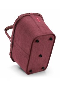 Runder Stoffkorb aus rotem Material mit weicher Textur und verstärktem Griff. Schwarze Füße an der Basis erhöhen die Stabilität.