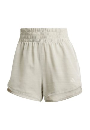 Pantalones cortos deportivos de color beige claro con una cinturilla elástica, textura suave, de longitud corta, con bolsillos laterales y un logo discreto en el dobladillo.