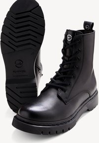 Black leather ankle boots with round toe, lace-up front, rubber outsole featuring a tread pattern, and a looped heel tab for easy wear.