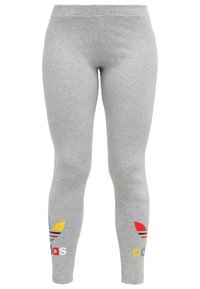 Grå leggings gjorda av mjukt tyg, med tre ränder i blått, gult och rött på underbenen och "adidas"-logotypen tryckt i vitt.