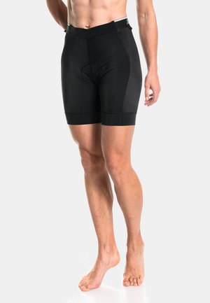 Schwarze Radshorts mit eng anliegendem Schnitt, ausgestattet mit einer gepolsterten Einlage, strukturiertem Mesh-Einsatz an der Seite und einem breiten elastischen Bund.