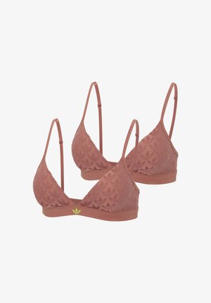 Dos tops tipo bralette acolchados marrones con tirantes ajustables y patrones texturizados sutiles, con un pequeño logo de Adidas en verde neón en la banda.