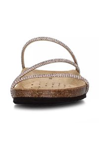 Cork slide sandal with three glittering straps, beige base, and black outsole. Textured footbed with ventilation holes for comfort.