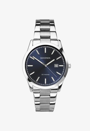 Montre en acier inoxydable argenté avec un cadran dégradé bleu, des index argentés et un affichage de la date. Étanche jusqu'à 50 mètres.