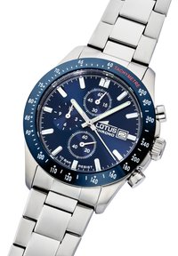 Stainless steel watch with a blue dial, tachymeter bezel, chronograph features, silver hands, and a link bracelet. Water-resistant to 10 bar.