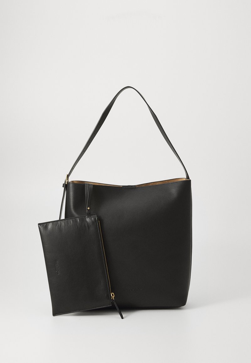 Black leather tote bag with a single long handle and a detachable zippered pouch. Smooth texture and gold-tone hardware accents.