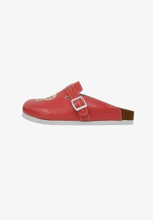 Red slip-on shoe with a textured leather upper and a white buckle. Features a flat white sole and a printed design on the front.