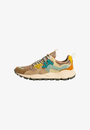 Multicolor floral-patterned sneaker with beige, teal, yellow, and orange suede overlays, gray laces, and a thick white sole with black tread.