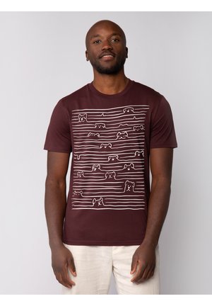 Bordeaux T-shirt met korte mouwen, voorzien van een wit lijnpatroon van hondengezichten. Gemaakt van zachte stof met een klassiek ronde hals ontwerp.
