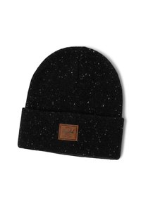 Gorro de punto hecho de hilo negro con motas blancas, que presenta un puño doblado y un parche de cuero marrón con el logo en la parte frontal.
