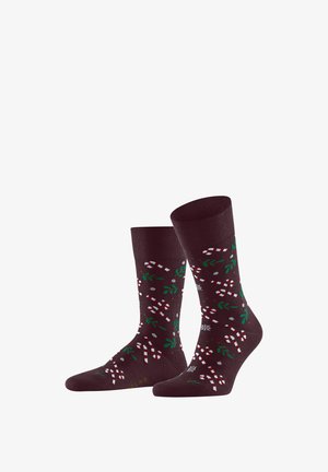 Calcetines burdeos oscuros con un diseño festivo que incluye bastones de caramelo, hojas verdes y copos de nieve. Textura suave y longitud hasta la mitad de la pantorrilla.