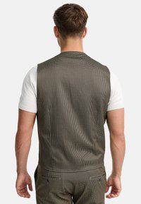 Grau kariertes Sakko mit taillierter Passform, aus einem strukturierten Stoff gefertigt. Verfügt über einen einzelnen Rückenschlitz und verstellbare Riemen in der Taille.