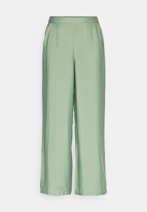 Helle grüne, weit geschnittene Hosen aus einem glatten, glänzenden Stoff. Verfügt über einen elastischen Bund und eine entspannte Passform. Keine sichtbaren Taschen.