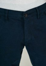 Bermudas Reell Flex Grip Chino Superior Bege - Fútbol Emotion