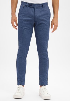 - Spodnie materiałowe