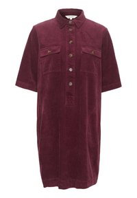 Cordkleid aus Cord in tiefem Burgunderrot. Verfügt über einen Kragen, kurze Ärmel, zwei Brusttaschen und eine durchgehende Knopfleiste. Strukturierter Stoff.
