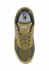 Olive green athletic shoe with mesh and suede materials, rounded toe, padded collar, and gray detailing. Features laces and branding on the tongue.