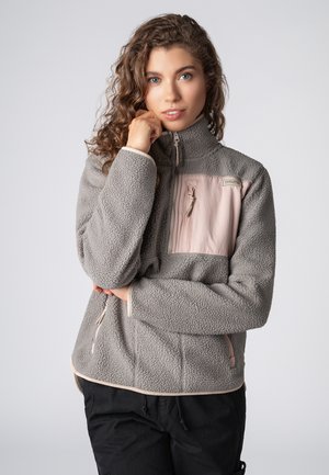 Gray fleece jacket with a light pink chest panel, zippered pocket, and contrasting accents. Features a high collar and elastic cuffs.