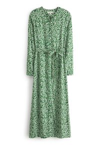 Robe florale verte avec des manches longues, une ceinture à nouer à la taille et un col rond. Présente de petits motifs de fleurs blanches sur un fond vert.