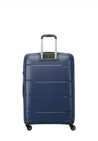 Valigia rigida blu navy, con design aerodinamico, superficie testurizzata, doppie ruote e manico retrattile.