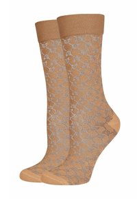 Beige Socken mit einem gemusterten Design in hellgrau. Gerippter Oberteil mit mittelhohem Sitz. Weicher Stoff, geeignet für Freizeitkleidung.