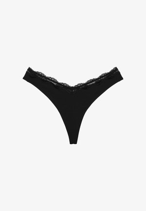 Black lace-trimmed thong underwear featuring a scalloped lace waistband. Made from soft fabric with a smooth texture. Minimalistic design.