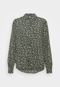 Camicia a maniche lunghe con bottoni, di colore verde scuro e con un motivo floreale, che presenta fiori bianchi e verde chiaro, in tessuto morbido e con orlo curvo.