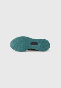 Semelle en caoutchouc de couleur turquoise avec un motif de bande de roulement texturé et une découpe centrale. Conçue pour l'adhérence et la durabilité.