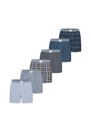 Six pairs of men's boxer shorts in various blue and brown plaid and striped patterns, arranged in a cascading row on a white background.