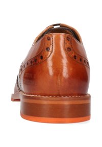 Braune Leder-Lederschuhe mit durchbrochenen Broguedetails, abgerundetem Zehenbereich und einer glatten Oberfläche. Mit einem kontrastierenden helleren Sohlenfinish.