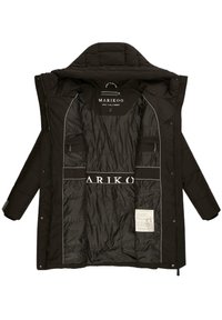 Black puffer jacket with a zip closure, multiple interior pockets, and a quilted lining. Features logo print and care label on the inside.