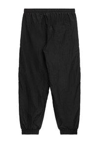 UNFAIR ATHLETICS SELECTED - Treniņtērpa apakšdaļas - black