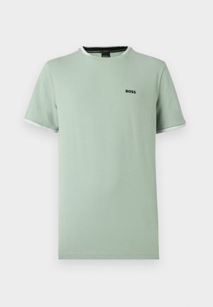 T-shirt de manga curta verde claro feita de algodão, com gola redonda com acabamento branco e pequeno logótipo preto no peito.