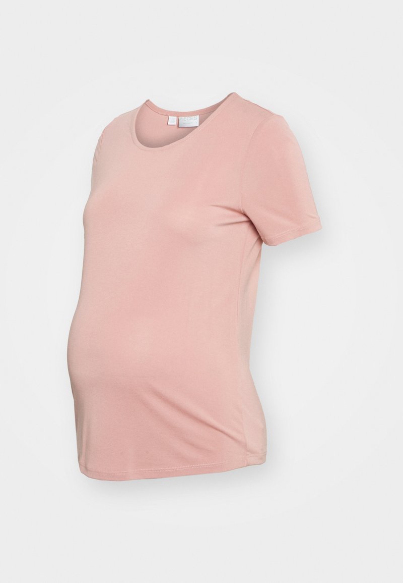 T-shirt de maternidade em tecido suave, cor rosa claro. Apresenta um decote redondo e mangas curtas. O corte é descontraído para acomodar a barriga em crescimento.