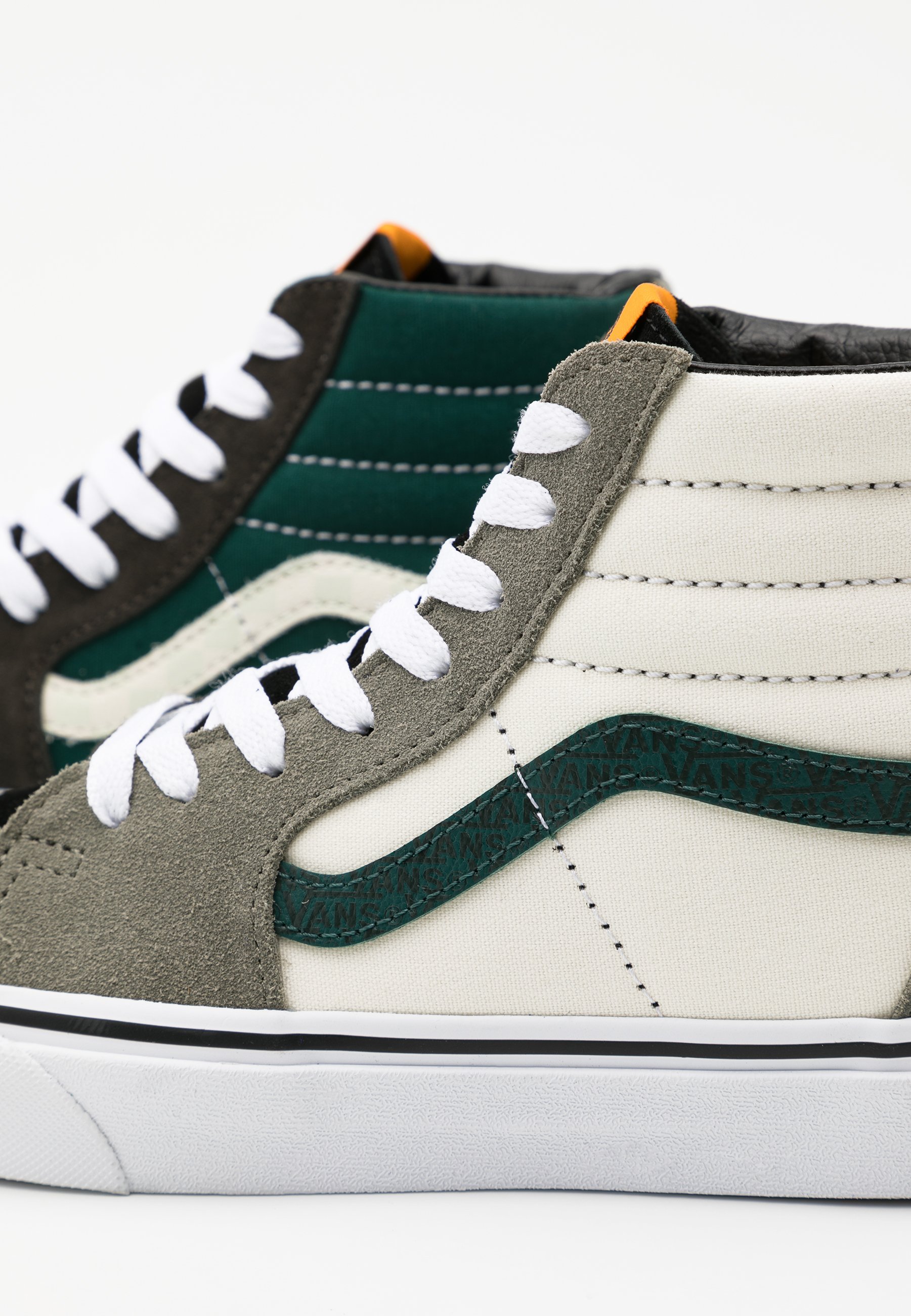 green and white high top vans