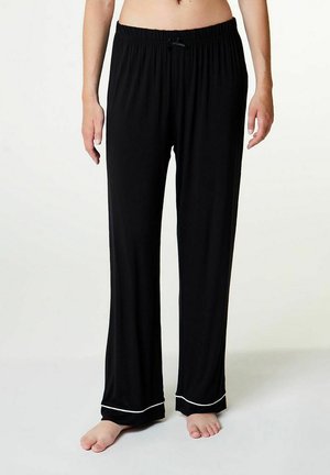 Zwarte pyjamabroek met een elastische tailleband en trekkoord, voorzien van een witte rand aan de zoom. Gemaakt van zachte stof voor comfort.