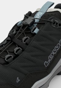 Black outdoor shoes with a textured upper, featuring a quick-lacing system, gray accents, and a subtle logo along the side.