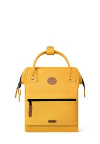 Yellow backpack with a textured fabric, featuring a top handle, zipper closure, front pocket, and a circular logo patch.