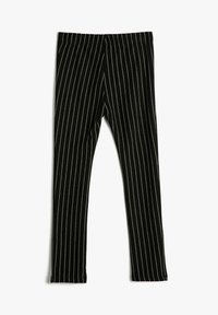 Mallas negras con rayas verticales blancas. Tejido suave, diseño ajustado, cinturilla elástica y detalles de costura mínimos.