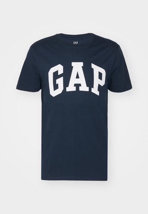 Navy blue cotton t-shirt with short sleeves and a round neck. Features large white "GAP" text across the front.