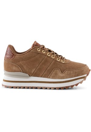 Brown suede sneaker with a textured brown leather accent at the heel, gold eyelets, and a white and brown striped rubber sole.