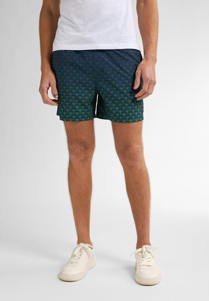 Marine zwemshorts met een groen palmbomenpatroon, gemaakt van lichtgewicht stof, met een elastische tailleband en een ontspannen snit.
